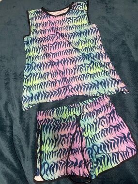 TomboyX Head Over Eels" set vibrant, multi-colored zebra-like print